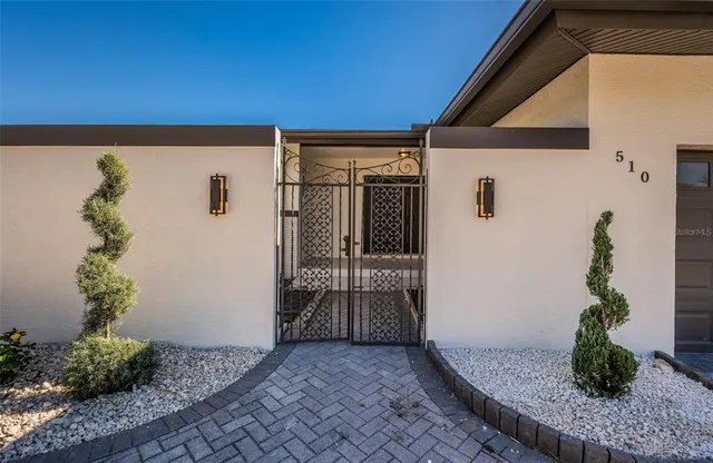 a view of a pathway with flower pots