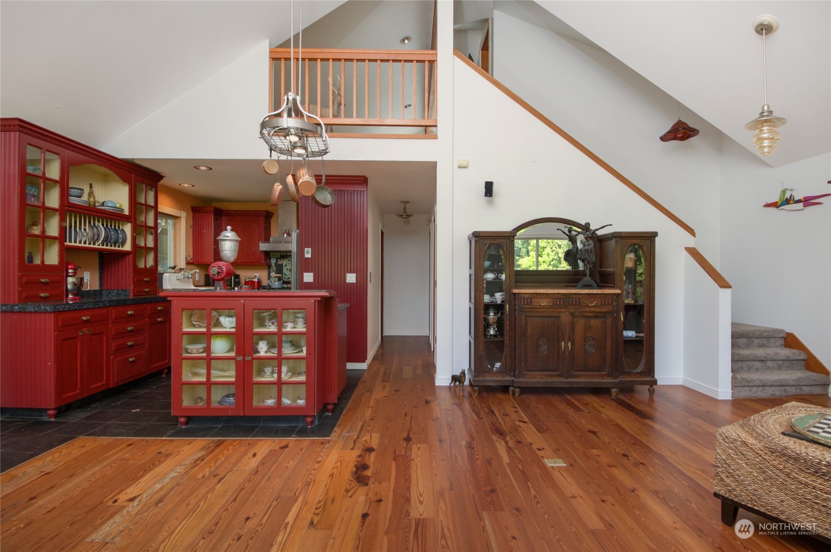 2215 Goss Ridge Road Freeland, WA 98249 - Photo 8 of 40 a view of a hallway with wooden floor and staircase