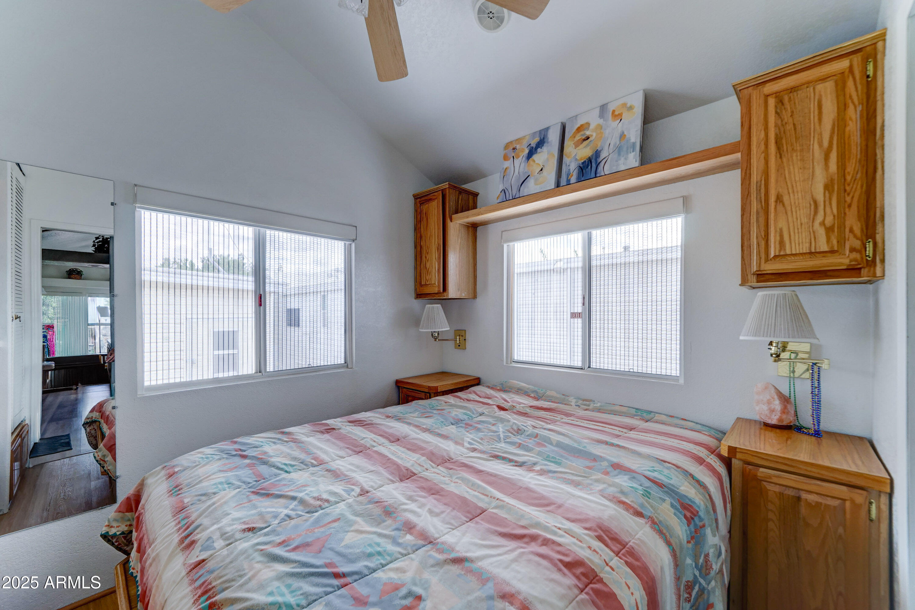 111 South Greenfield Road, Unit 552 Mesa, AZ 85206 - Photo 9 of 24 a bedroom with a bed and a window