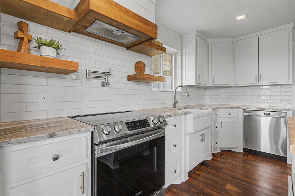 192 Riverside Drive Decatur, TX 76234 - Photo 12 of 32 a kitchen with cabinets appliances and wooden floor