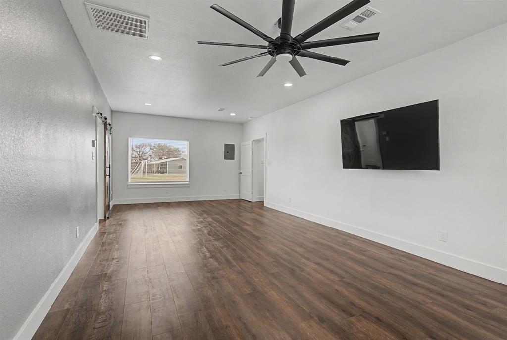 192 Riverside Drive Decatur, TX 76234 - Photo 17 of 32 wooden floor in an empty room with a window