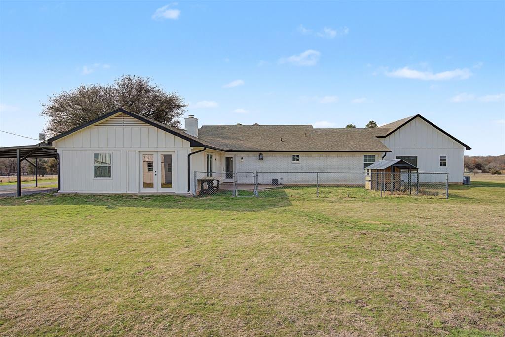 192 Riverside Drive Decatur, TX 76234 - Photo 29 of 32 a view of a house with a big yard and large tree