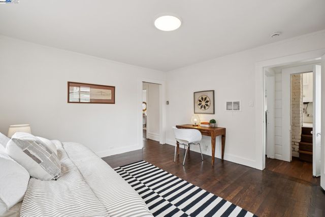 a bedroom with a bed and a table in it