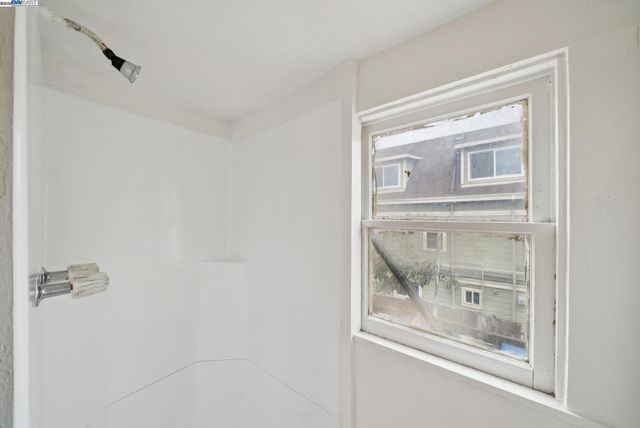 a bathroom with a glass shower door