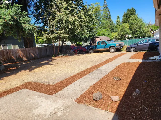 a view of street with parked cars