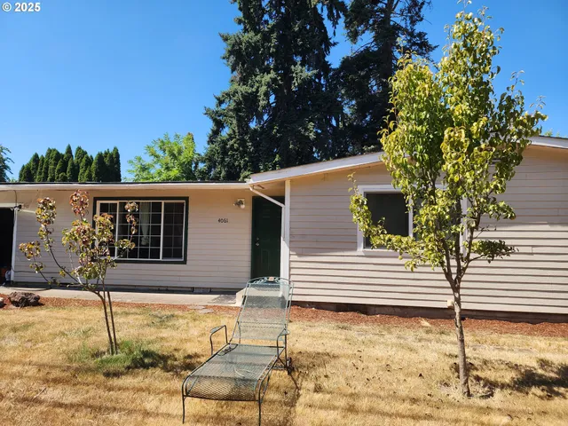 a view of a house with snow on the road