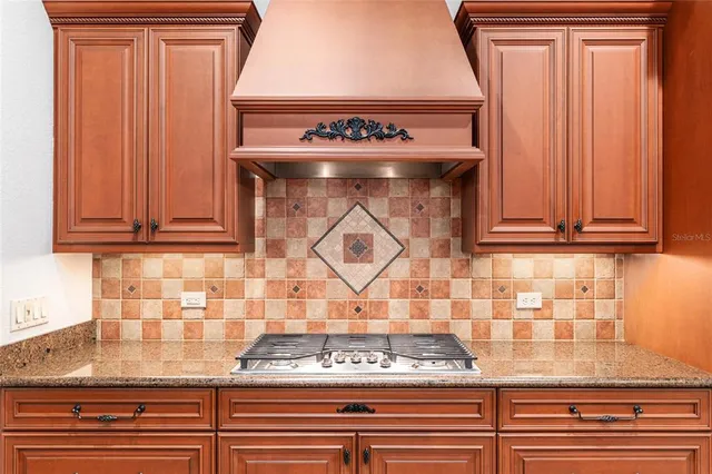 a living room with lots of furniture and paintings on the wall