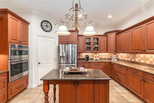 a kitchen with a stove and a sink