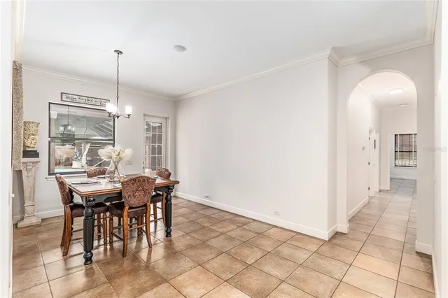 an aerial view of residential houses with outdoor space and lake view