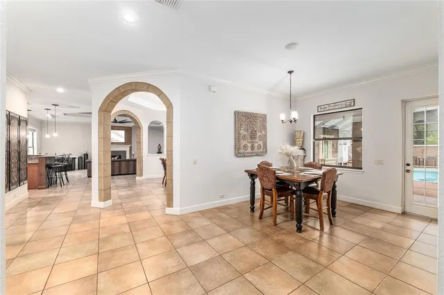 an aerial view of a house with swimming pool and patio