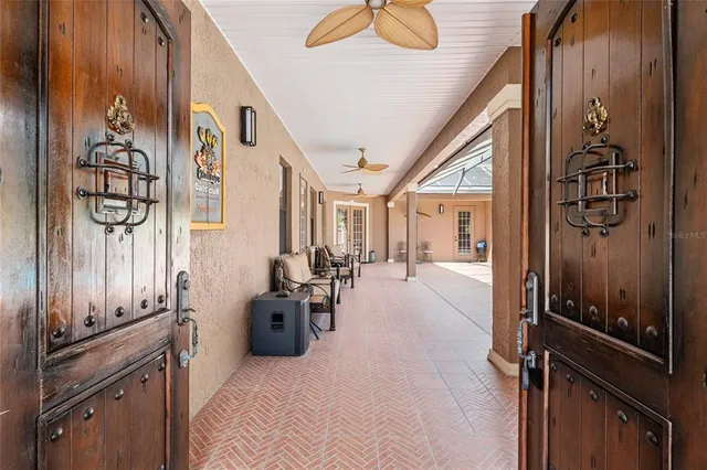 a view of a patio with a table and chairs