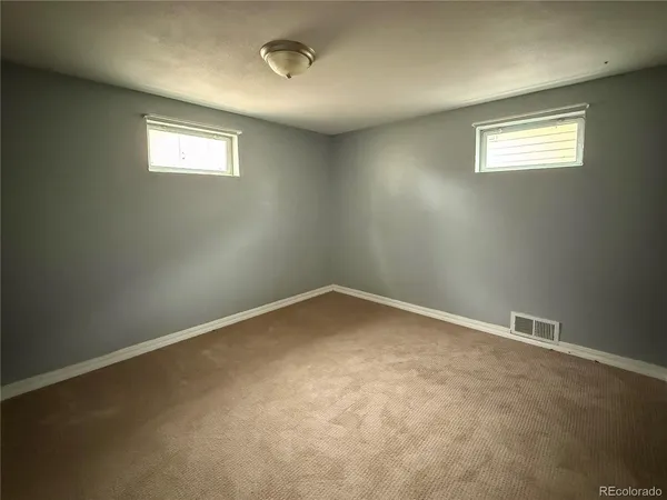 an empty room with closet area