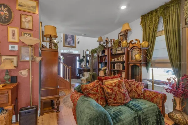 a bed room with a bed and a painting on the wall