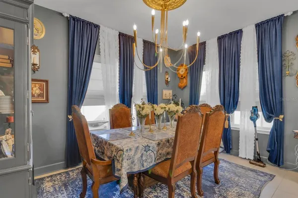 a dining room with furniture and window