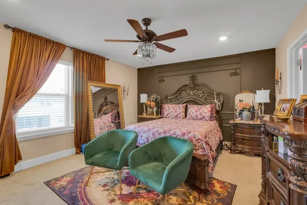 a bedroom with a bed and window