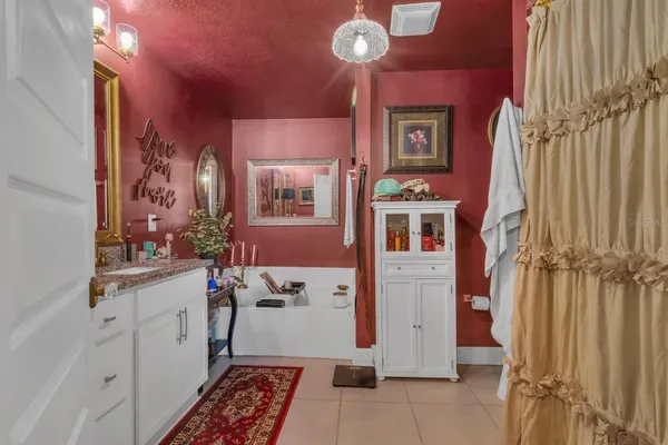a kitchen with a refrigerator and a stove