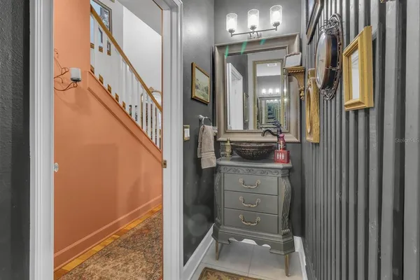 a view of a hallway with a furniture and a mirror