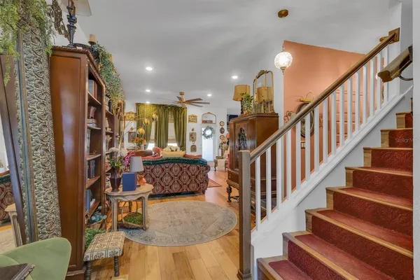a view of entryway and hall with wooden floor