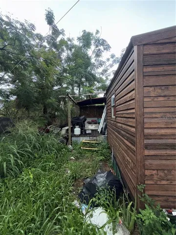 a view of a backyard with sitting area