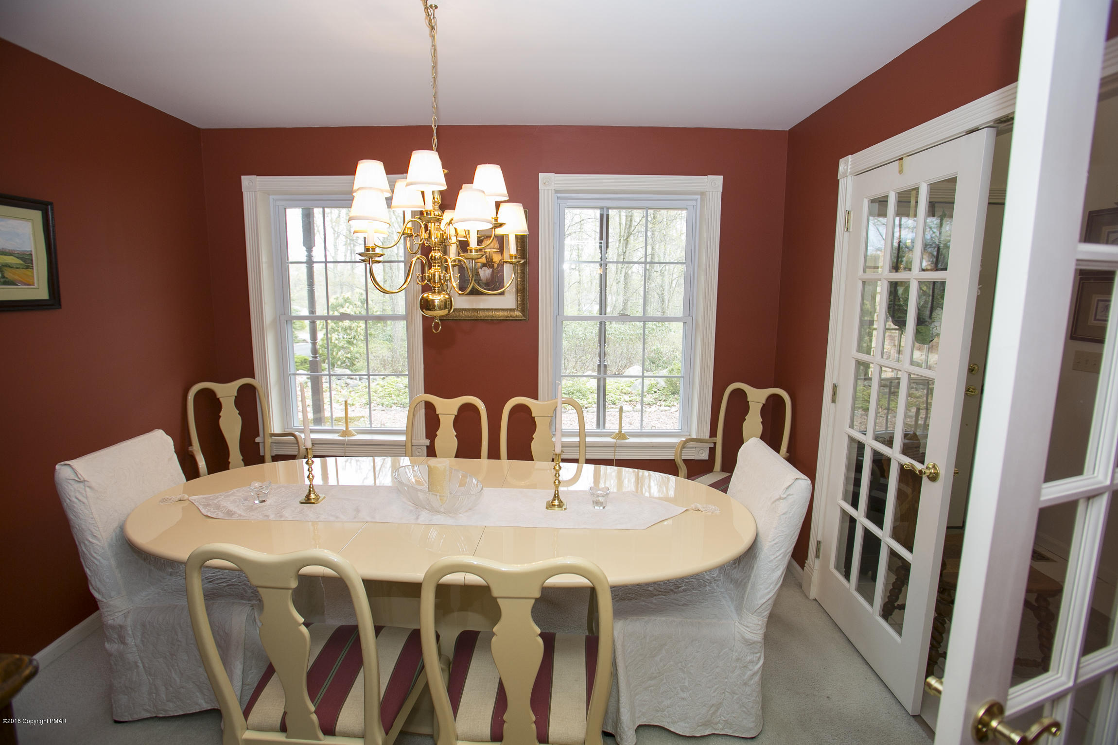 223 Cactus Road Stroudsburg, PA 18360 - Photo 12 of 38 a dining room with furniture a chandelier and window