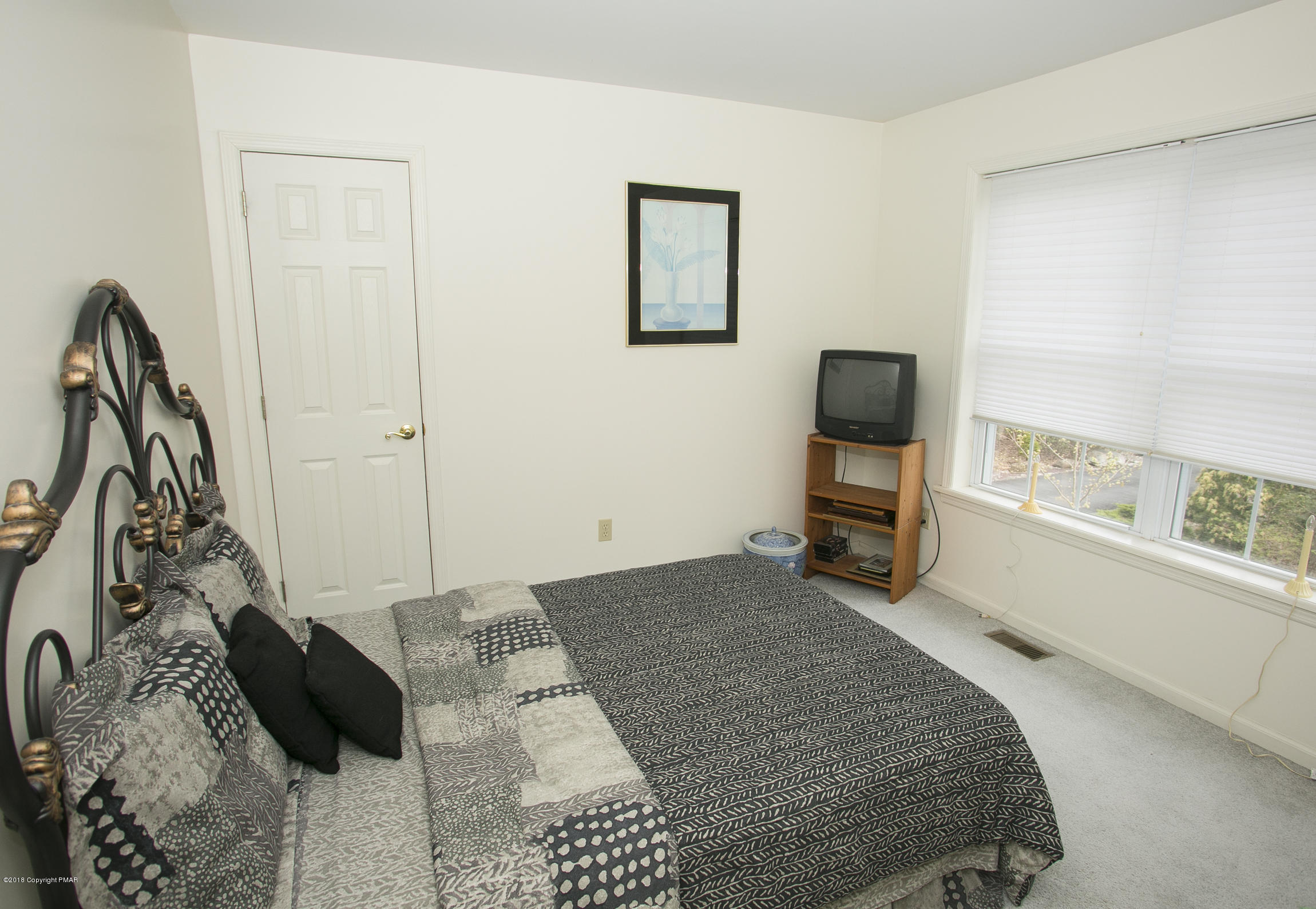 223 Cactus Road Stroudsburg, PA 18360 - Photo 19 of 38 a bedroom with a bed and a window