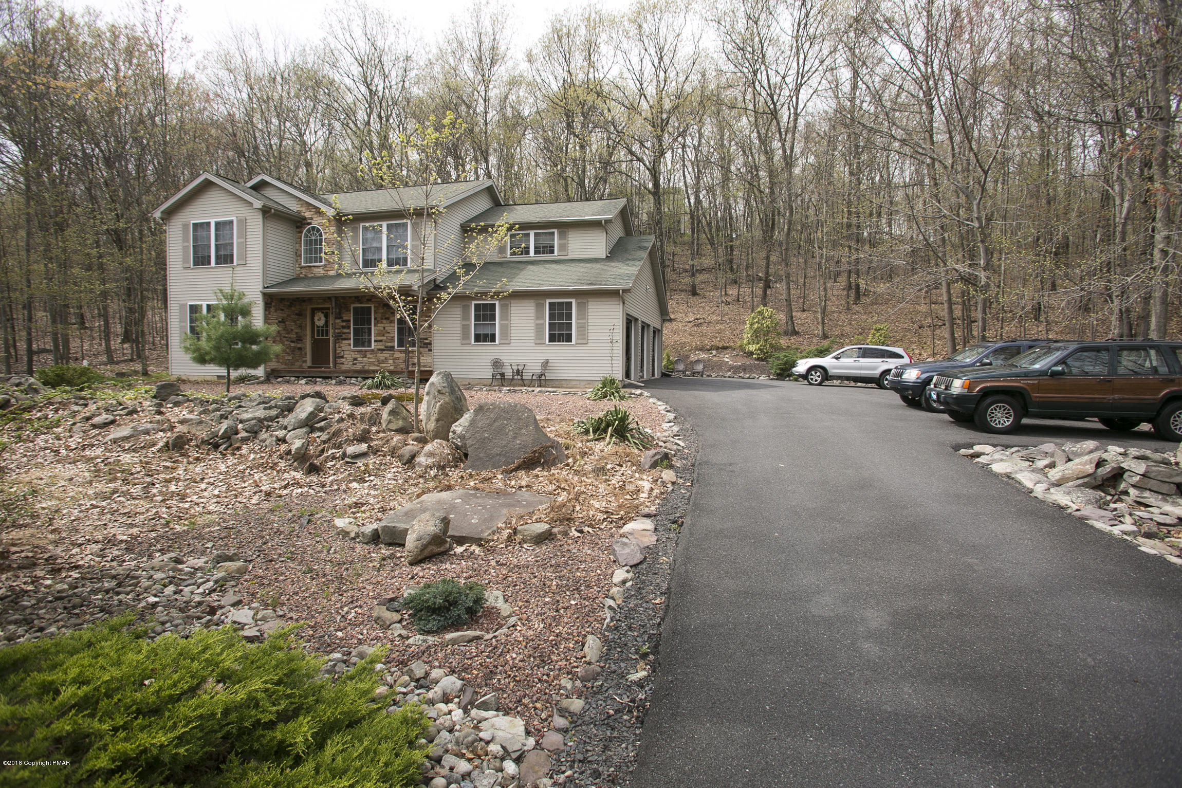 223 Cactus Road Stroudsburg, PA 18360 - Photo 25 of 38 a view of a house with a cars park side of a road