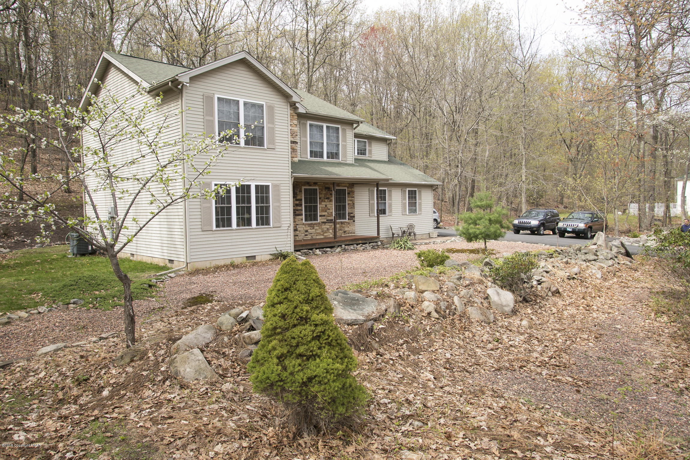 223 Cactus Road Stroudsburg, PA 18360 - Photo 31 of 38 a front view of a house with garden