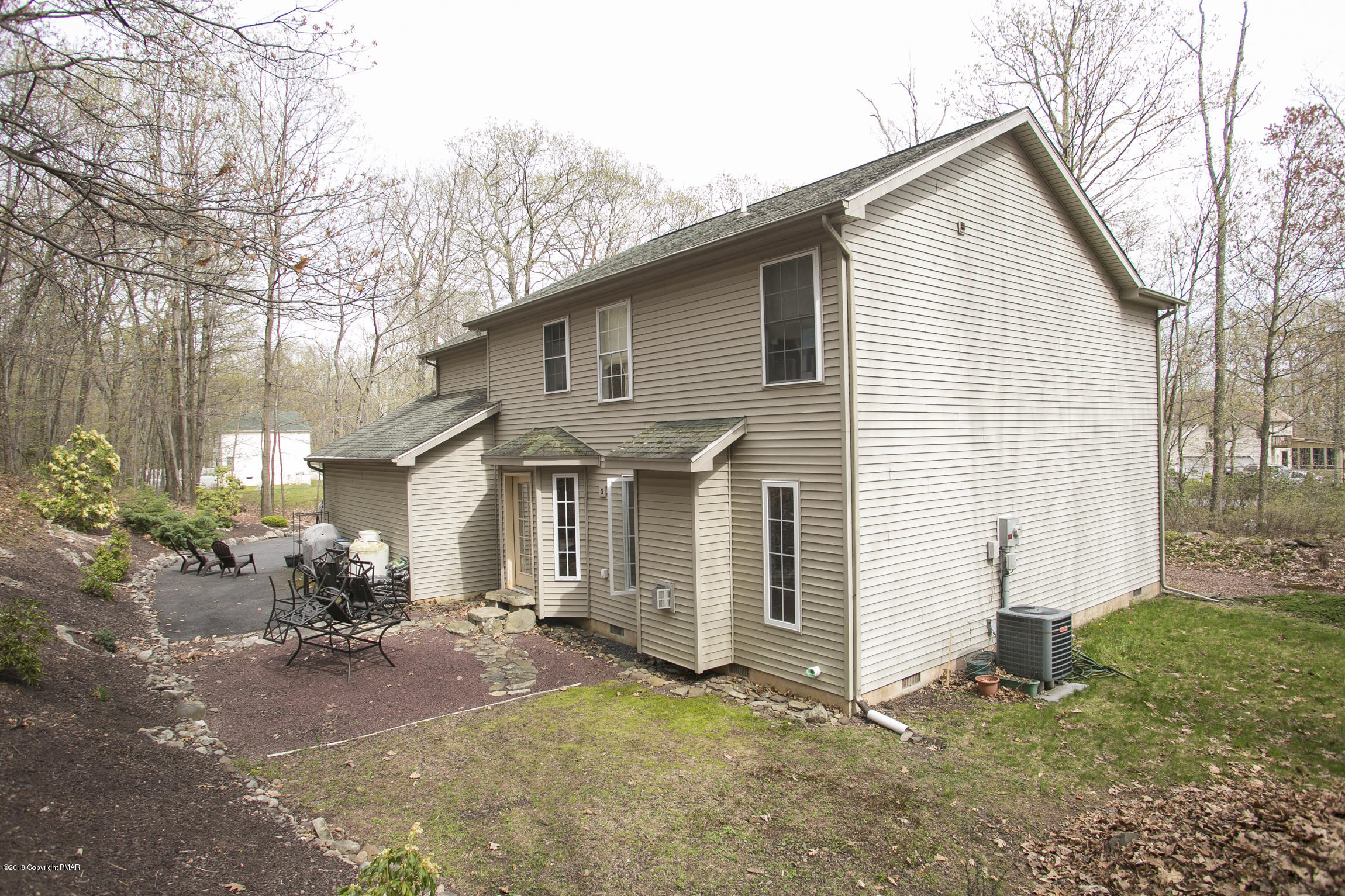 223 Cactus Road Stroudsburg, PA 18360 - Photo 34 of 38 a view of a house with yard and a garden