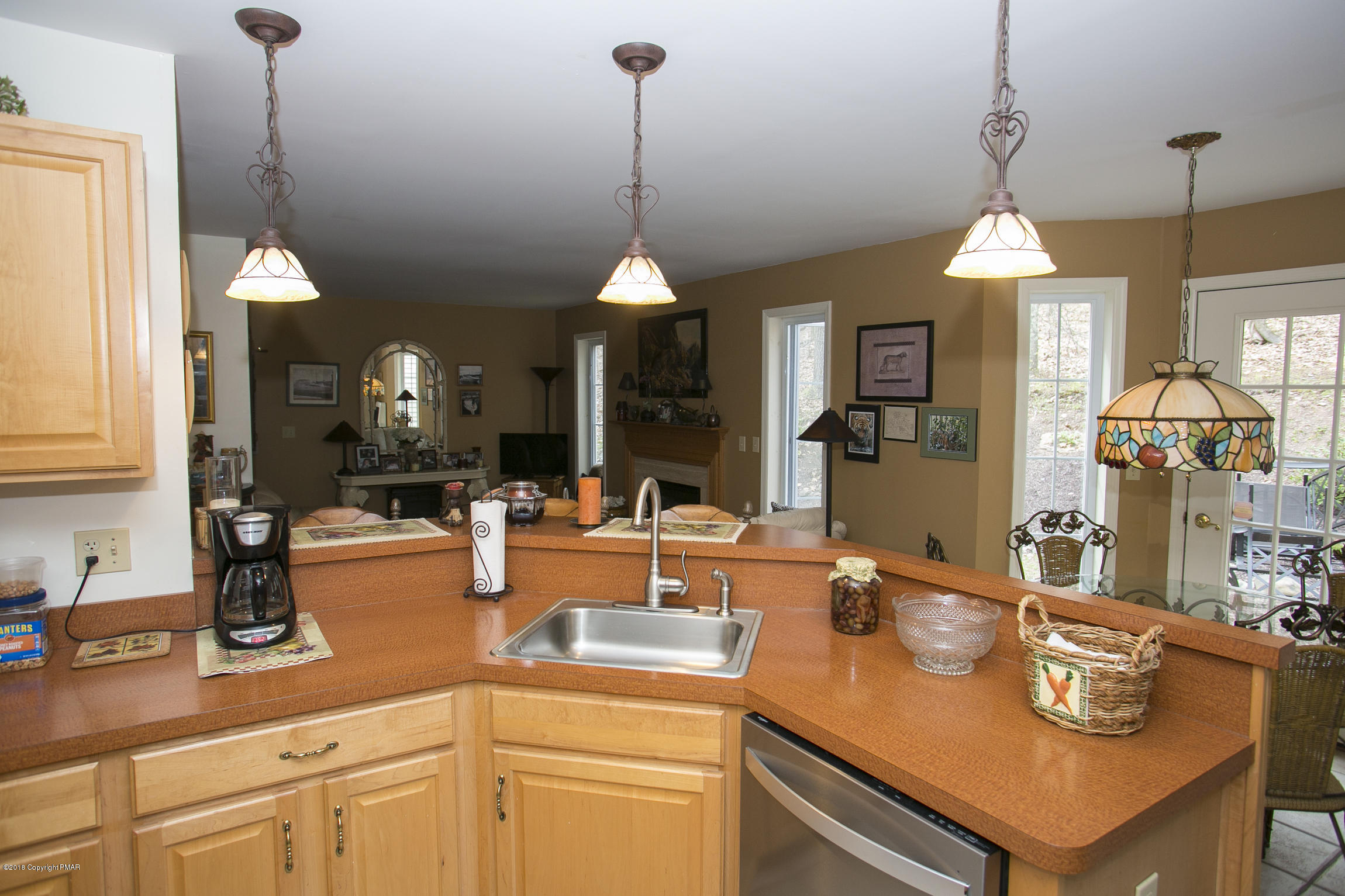 223 Cactus Road Stroudsburg, PA 18360 - Photo 4 of 38 a kitchen with a sink a counter and chairs