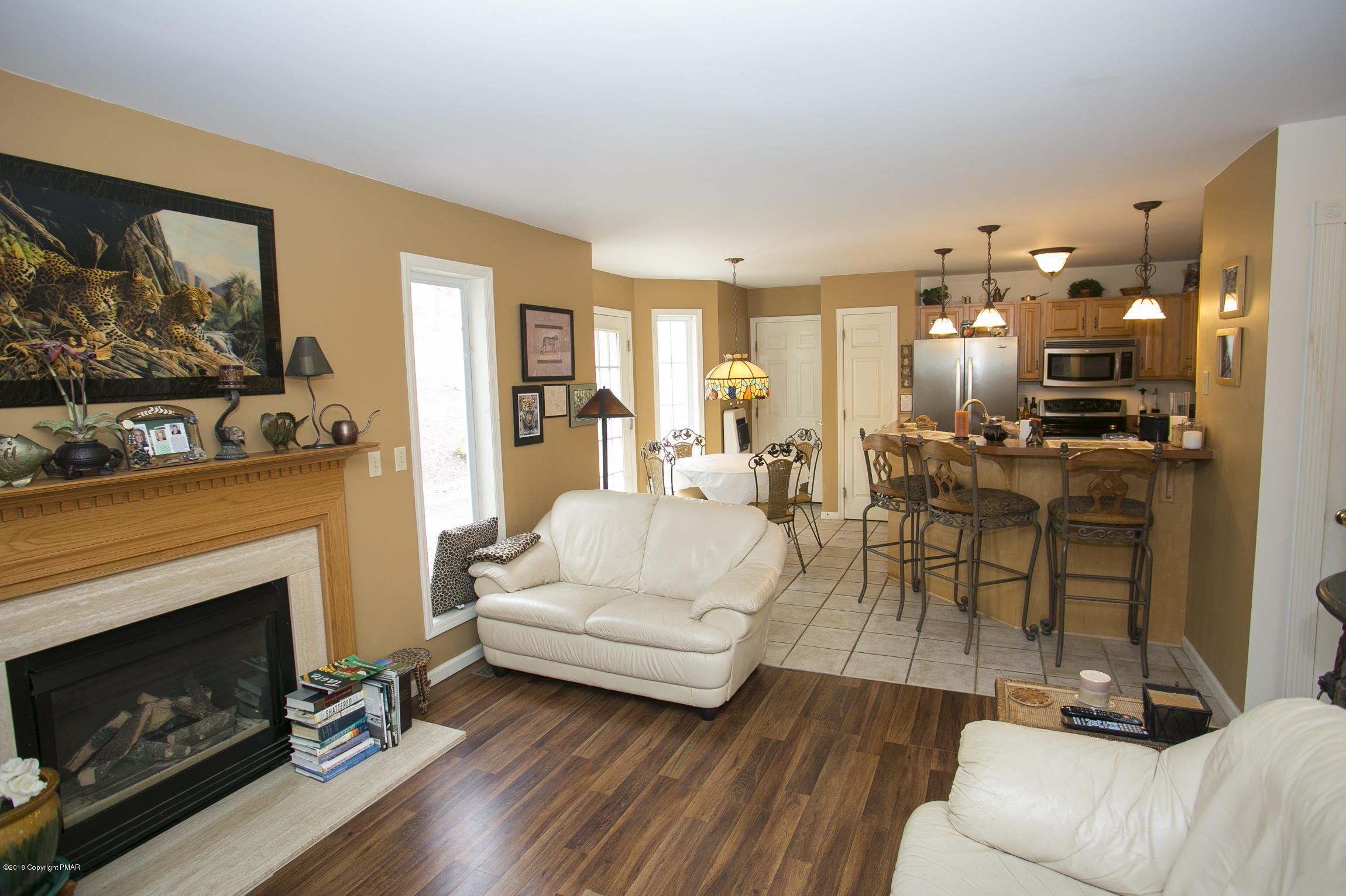 223 Cactus Road Stroudsburg, PA 18360 - Photo 6 of 38 a living room with furniture and a fireplace