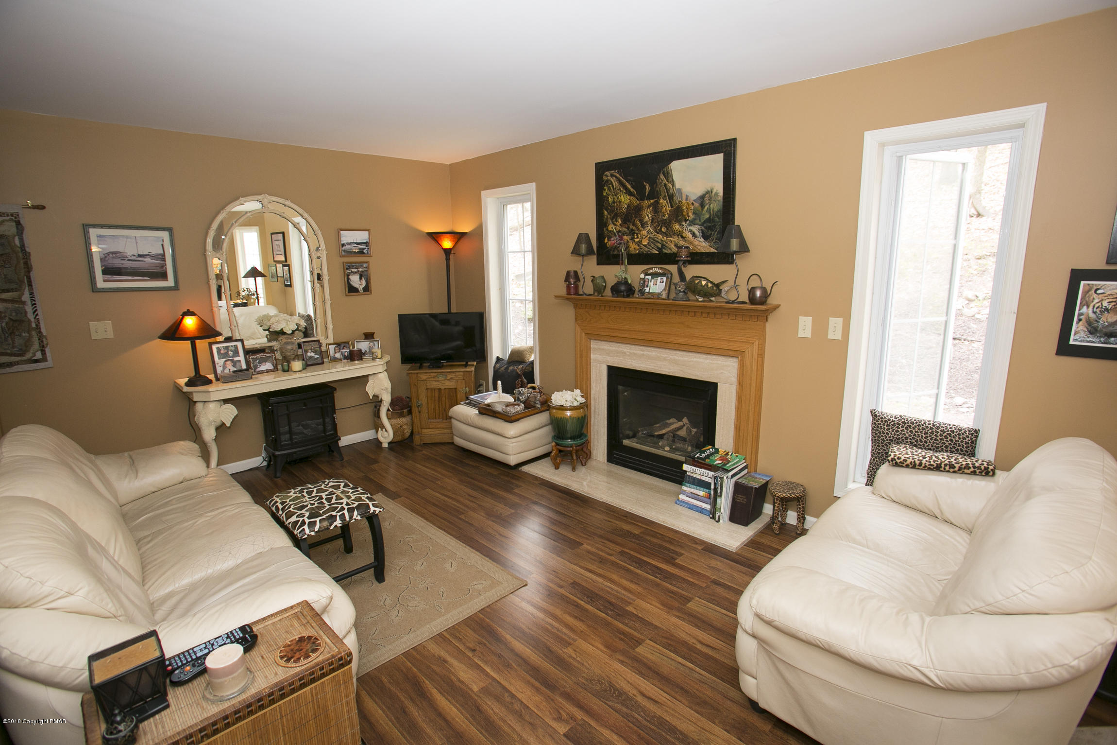 223 Cactus Road Stroudsburg, PA 18360 - Photo 7 of 38 a living room with furniture and a fireplace