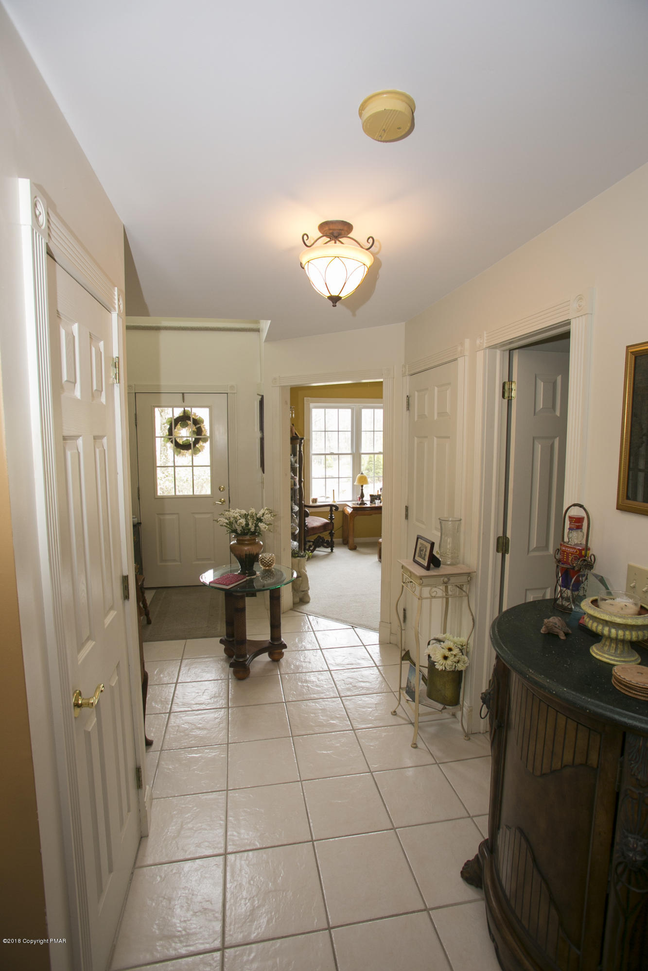 223 Cactus Road Stroudsburg, PA 18360 - Photo 9 of 38 a lobby with furniture and two windows