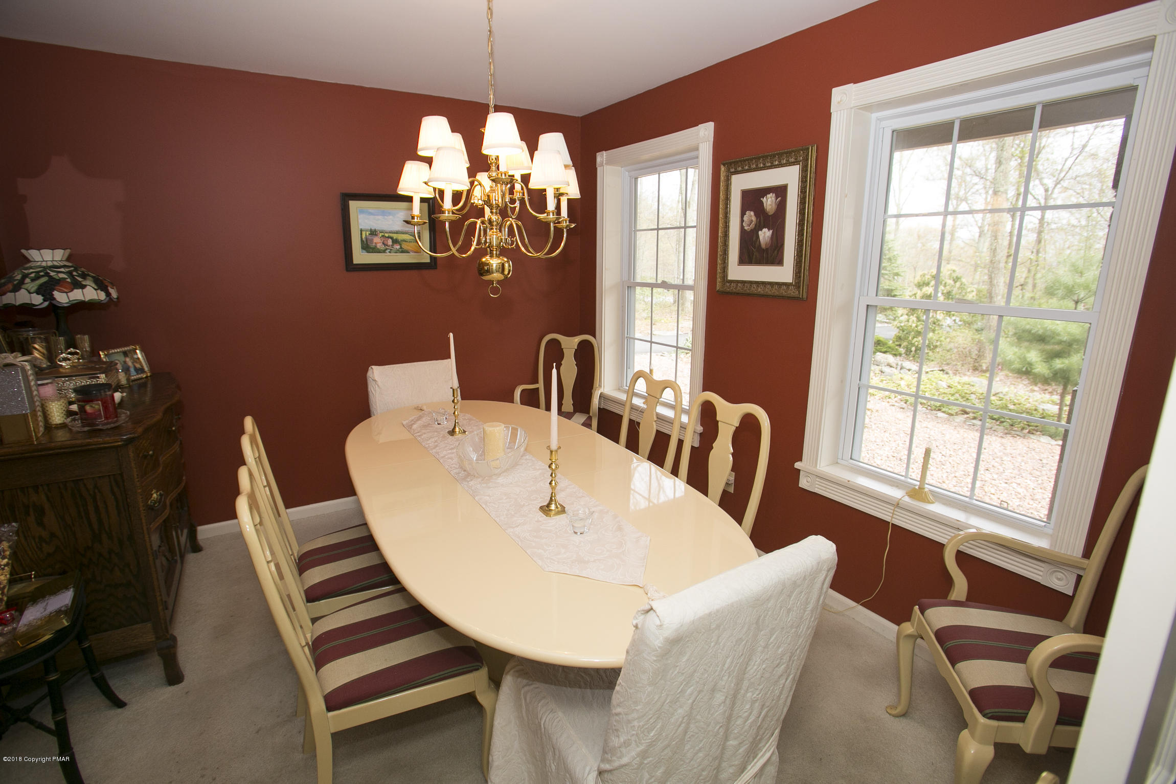 223 Cactus Road Stroudsburg, PA 18360 - Photo 10 of 38 a view of a dining room with furniture wooden floor and chandelier