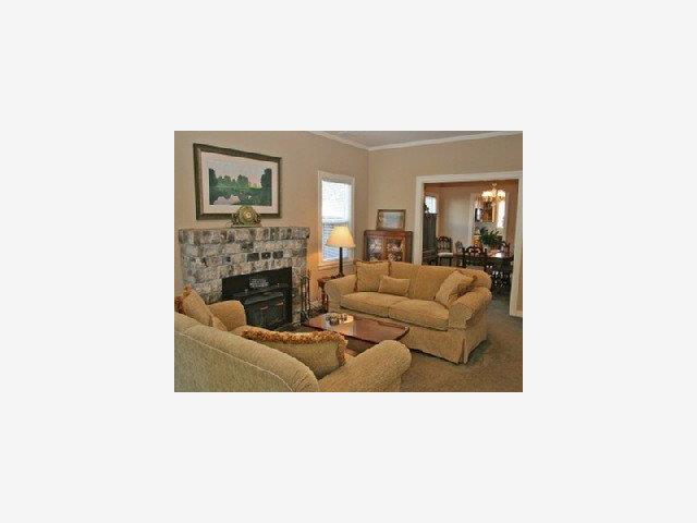 1227 Rhus Street San Mateo, CA 94402 - Photo 2 of 9 a living room with furniture and a fireplace