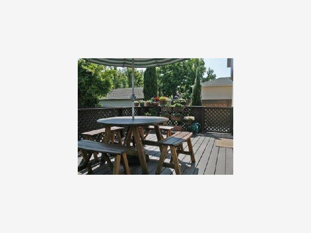 1227 Rhus Street San Mateo, CA 94402 - Photo 4 of 9 a living room with furniture and a floor to ceiling window