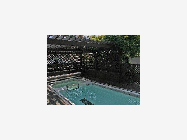 1227 Rhus Street San Mateo, CA 94402 - Photo 7 of 9 a bathroom with a sink and mirror