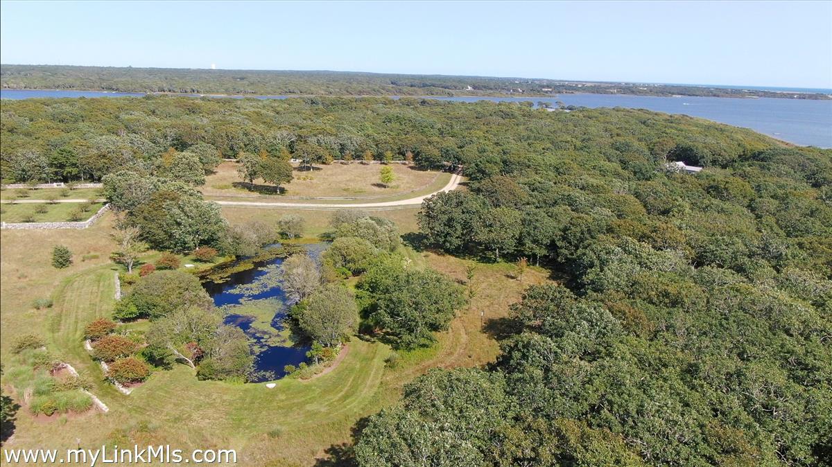 32 Boldwater Road Edgartown, MA 02539 - Photo 12 of 55 Stonewall Courtyards, Lily Pond and Grand Meadow with Long Stone Wall at Entrance to Property