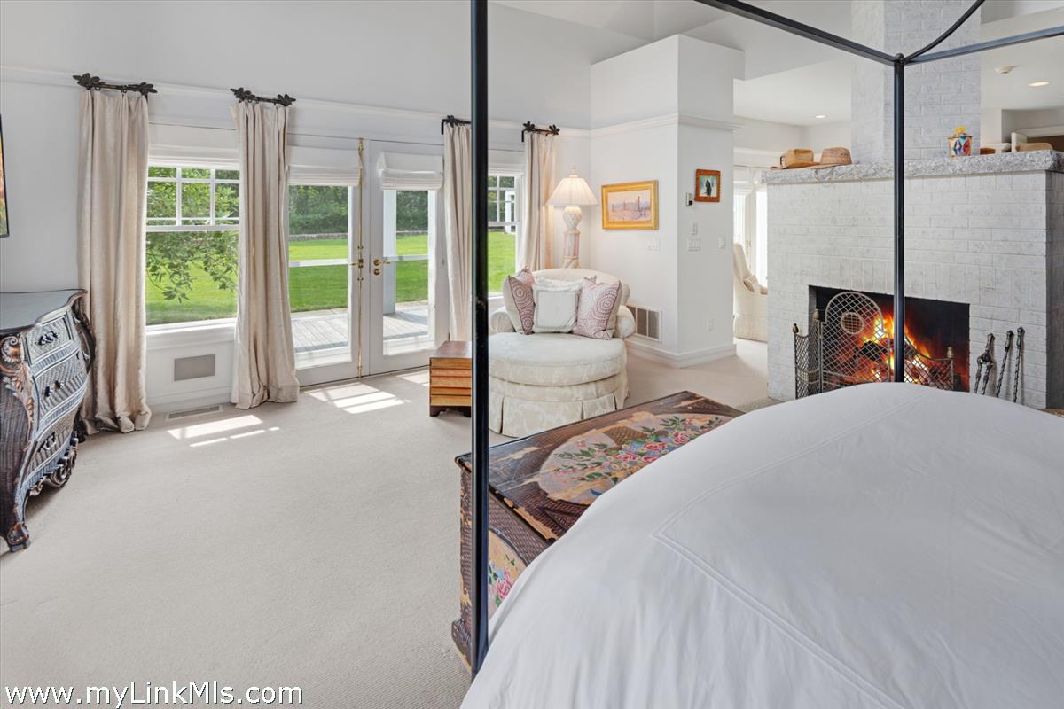 32 Boldwater Road Edgartown, MA 02539 - Photo 30 of 55 a spacious bedroom with a bed and a large window