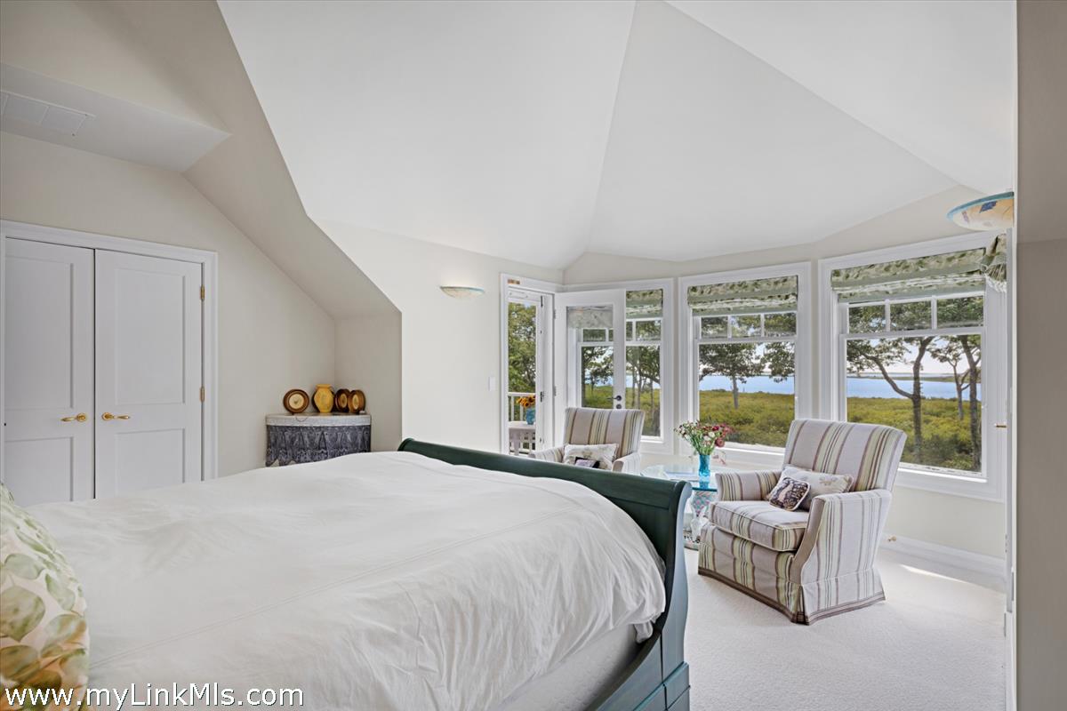 32 Boldwater Road Edgartown, MA 02539 - Photo 41 of 55 a spacious bedroom with a bed a couch and large window