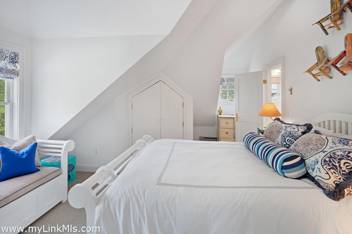 32 Boldwater Road Edgartown, MA 02539 - Photo 46 of 55 a bedroom with a bed and a painting on the wall