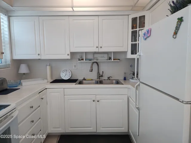 a kitchen with a sink and cabinets