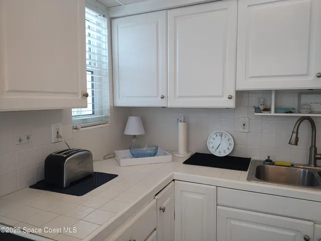 a kitchen with a cabinets and a stove