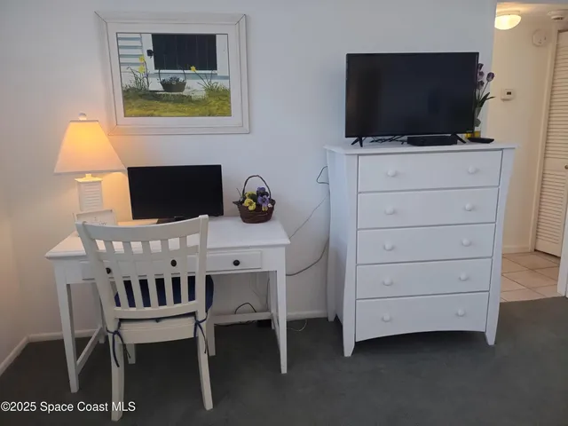 a bathroom with a sink vanity and mirror