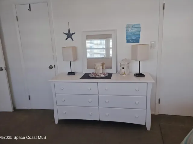 a white toilet sitting next to a bath tub