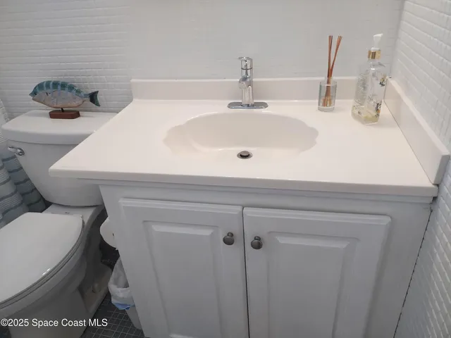 a bathroom with a sink and a toilet