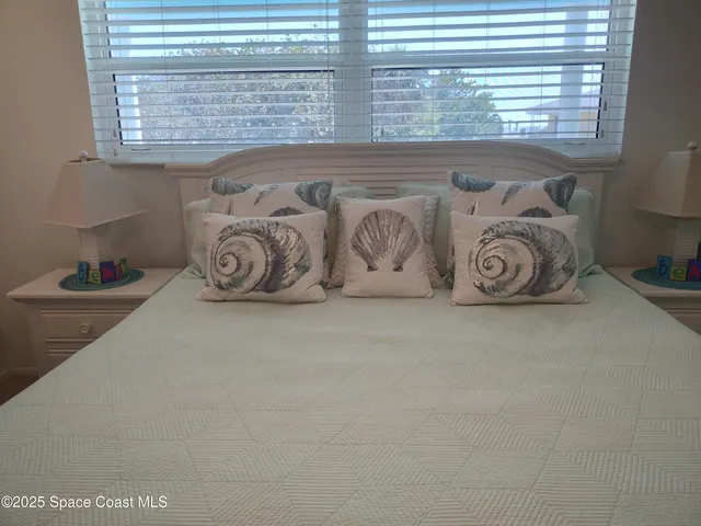 a view of a room that has a table and a chair