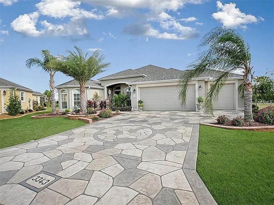 3343 Rabbit Run Path The Villages, FL 32163 - Photo 1 of 1 a front view of a house with garden