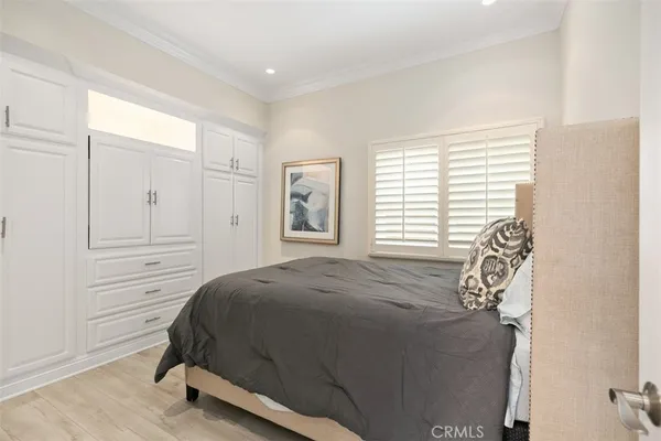 a bathroom with a shower sink vanity mirror and toilet
