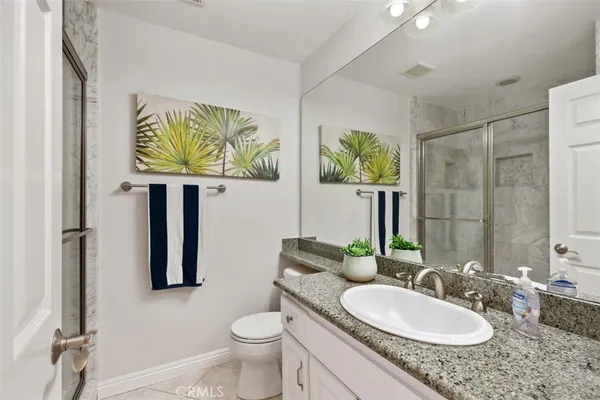 a view of a swimming pool with a patio and a yard