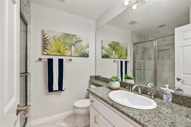 a view of a swimming pool with a patio and a yard